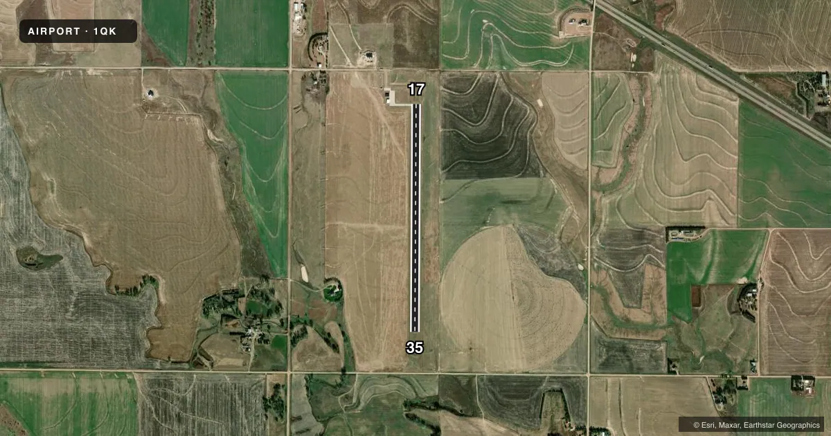 Top-down satellite sketch of 1QK GOVE COUNTY in QUINTER, KANSAS, showing runways 17/35 drawn to scale over Esri World Imagery