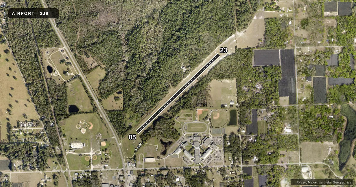 Top-down satellite sketch of 2J8 PIERSON MUNI in PIERSON, FLORIDA, showing runways 05/23 drawn to scale over Esri World Imagery