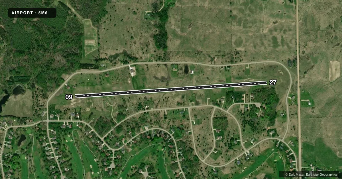 Top-down satellite sketch of 5M6 SUGAR SPRINGS AIRPARK in GLADWIN, MICHIGAN, showing runways 09/27 drawn to scale over Esri World Imagery