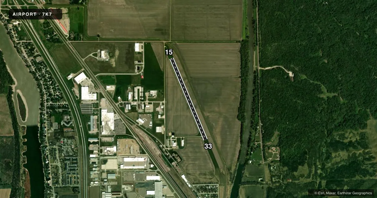 Top-down satellite sketch of 7K7 GRAHAM FLD in NORTH SIOUX CITY, SOUTH DAKOTA, showing runways 15/33 drawn to scale over Esri World Imagery