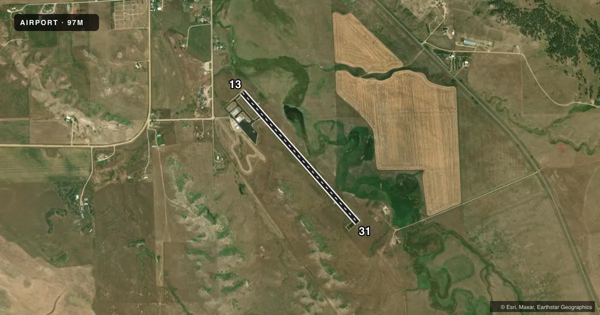 Top-down satellite sketch of 97M EKALAKA in EKALAKA, MONTANA, showing runways 13/31 drawn to scale over Esri World Imagery