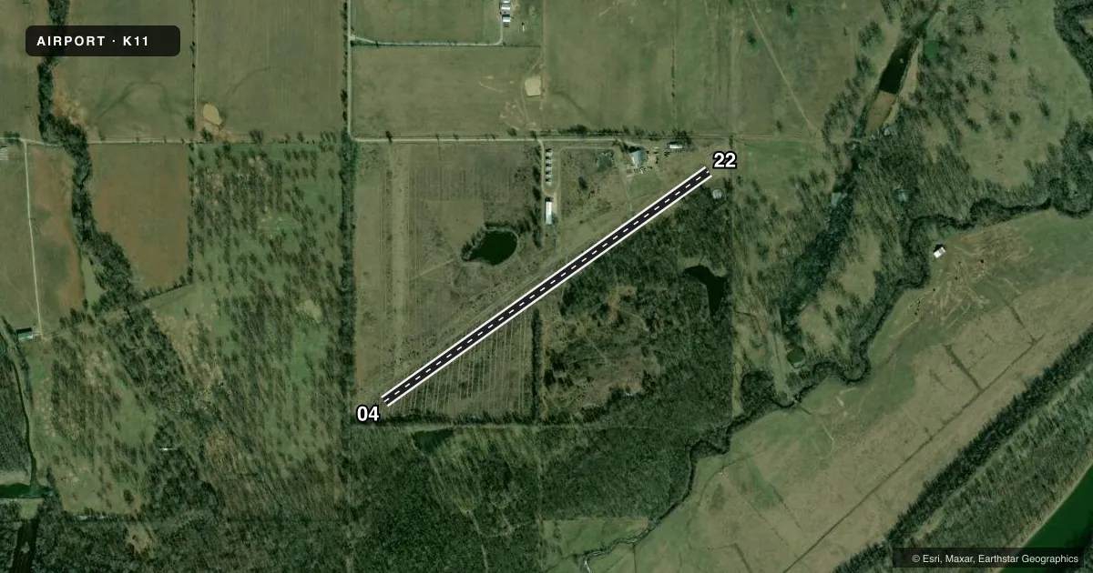 Top-down satellite sketch of K11 SAM RIGGS AIRPARK in CLAREMORE, OKLAHOMA, showing runways 04/22 drawn to scale over Esri World Imagery