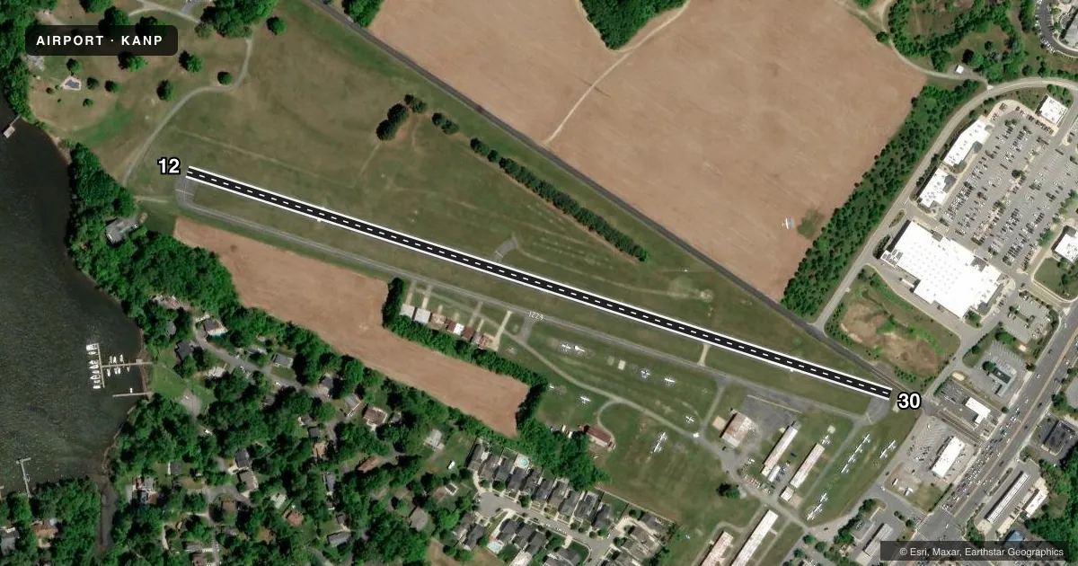 Top-down satellite sketch of KANP LEE in ANNAPOLIS, MARYLAND, showing runways 12/30 drawn to scale over Esri World Imagery