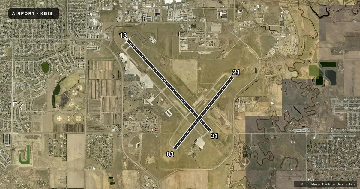 Top-down satellite sketch of KBIS BISMARCK MUNI in BISMARCK, NORTH DAKOTA, showing runways 13/31, 03/21 drawn to scale over Esri World Imagery
