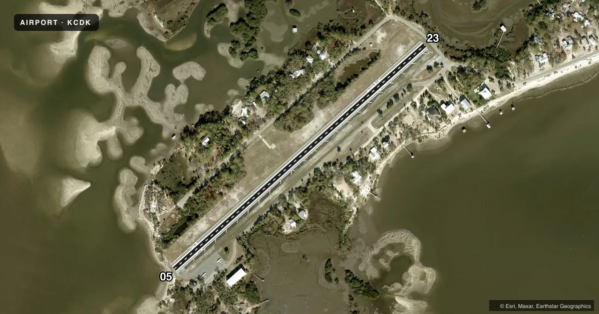Top-down satellite sketch of KCDK GEORGE T LEWIS in CEDAR KEY, FLORIDA, showing runways 05/23 drawn to scale over Esri World Imagery