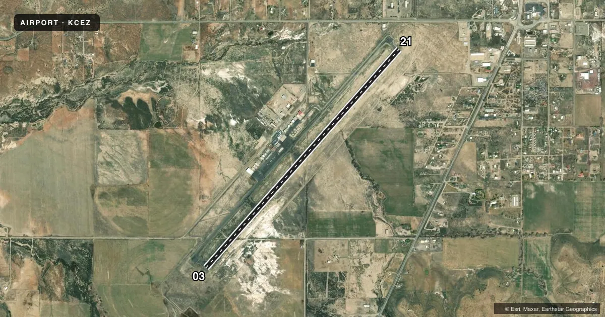 Top-down satellite sketch of KCEZ CORTEZ MUNI in CORTEZ, COLORADO, showing runways 03/21 drawn to scale over Esri World Imagery