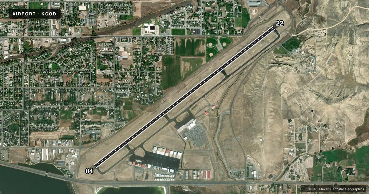 Top-down satellite sketch of KCOD YELLOWSTONE RGNL in CODY, WYOMING, showing runways 04/22 drawn to scale over Esri World Imagery