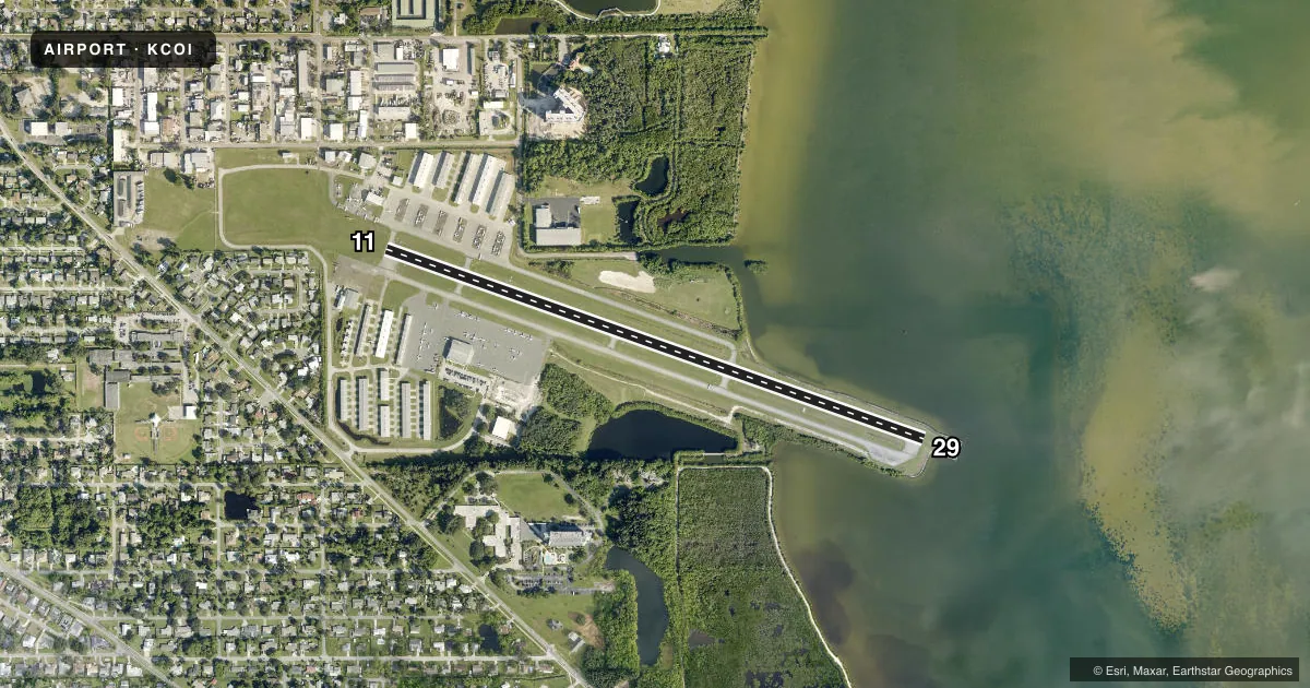 Top-down satellite sketch of KCOI MERRITT ISLAND in MERRITT ISLAND, FLORIDA, showing runways 11/29 drawn to scale over Esri World Imagery