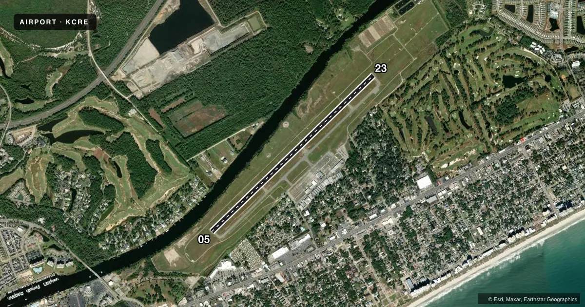 Top-down satellite sketch of KCRE GRAND STRAND in NORTH MYRTLE BEACH, SOUTH CAROLINA, showing runways 05/23 drawn to scale over Esri World Imagery