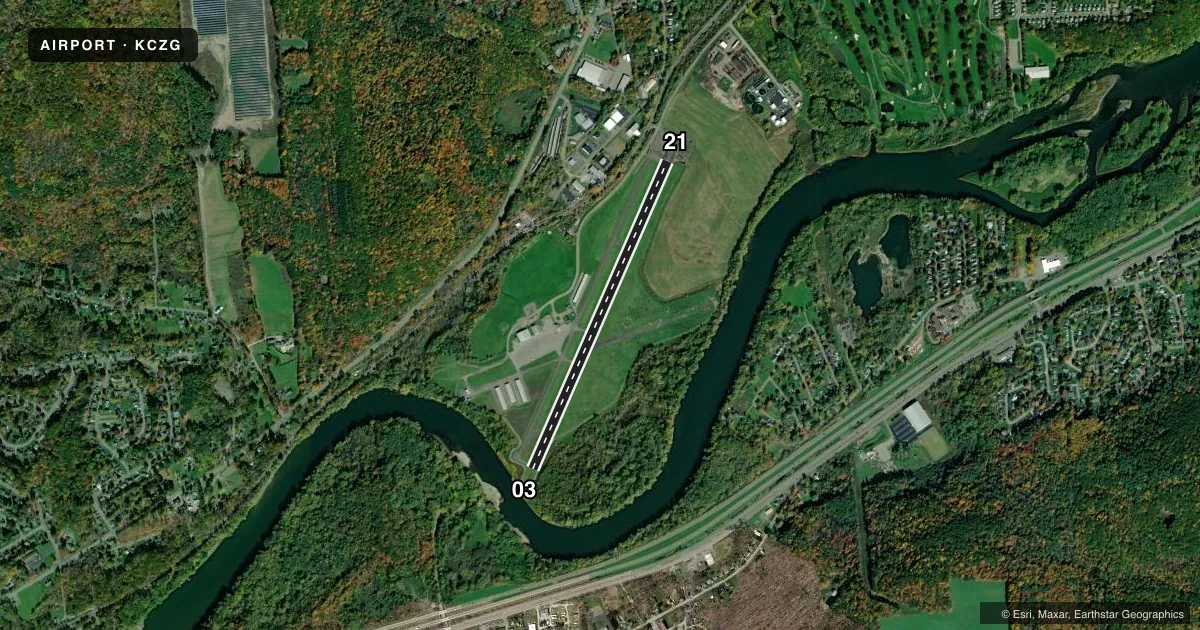 Top-down satellite sketch of KCZG TRI-CITIES in ENDICOTT, NEW YORK, showing runways 03/21 drawn to scale over Esri World Imagery