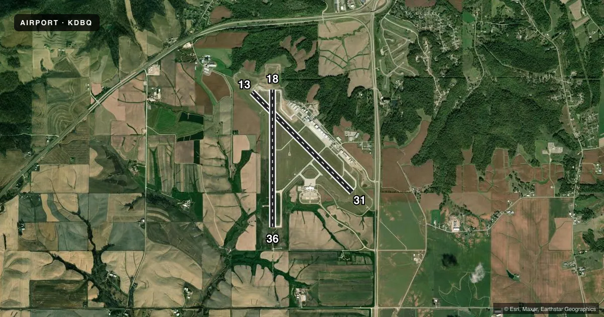 Top-down satellite sketch of KDBQ DUBUQUE RGNL in DUBUQUE, IOWA, showing runways 13/31, 18/36 drawn to scale over Esri World Imagery