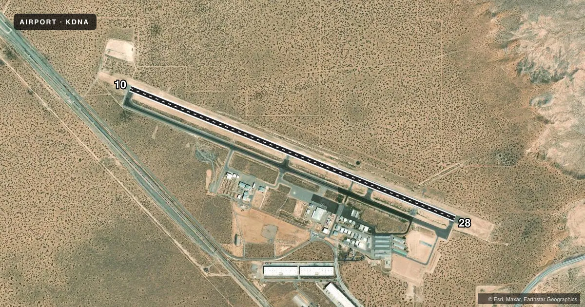 Top-down satellite sketch of KDNA DONA ANA COUNTY INTL JETPORT in SANTA TERESA, NEW MEXICO, showing runways 10/28 drawn to scale over Esri World Imagery