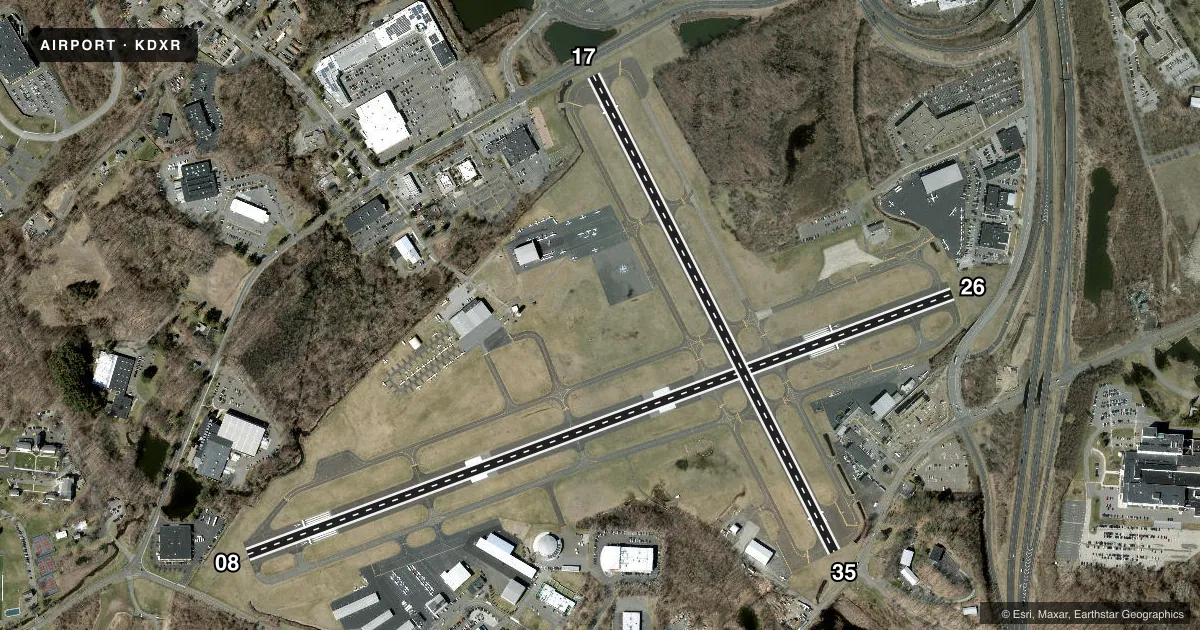 Top-down satellite sketch of KDXR DANBURY MUNI in DANBURY, CONNECTICUT, showing runways 08/26, 17/35 drawn to scale over Esri World Imagery
