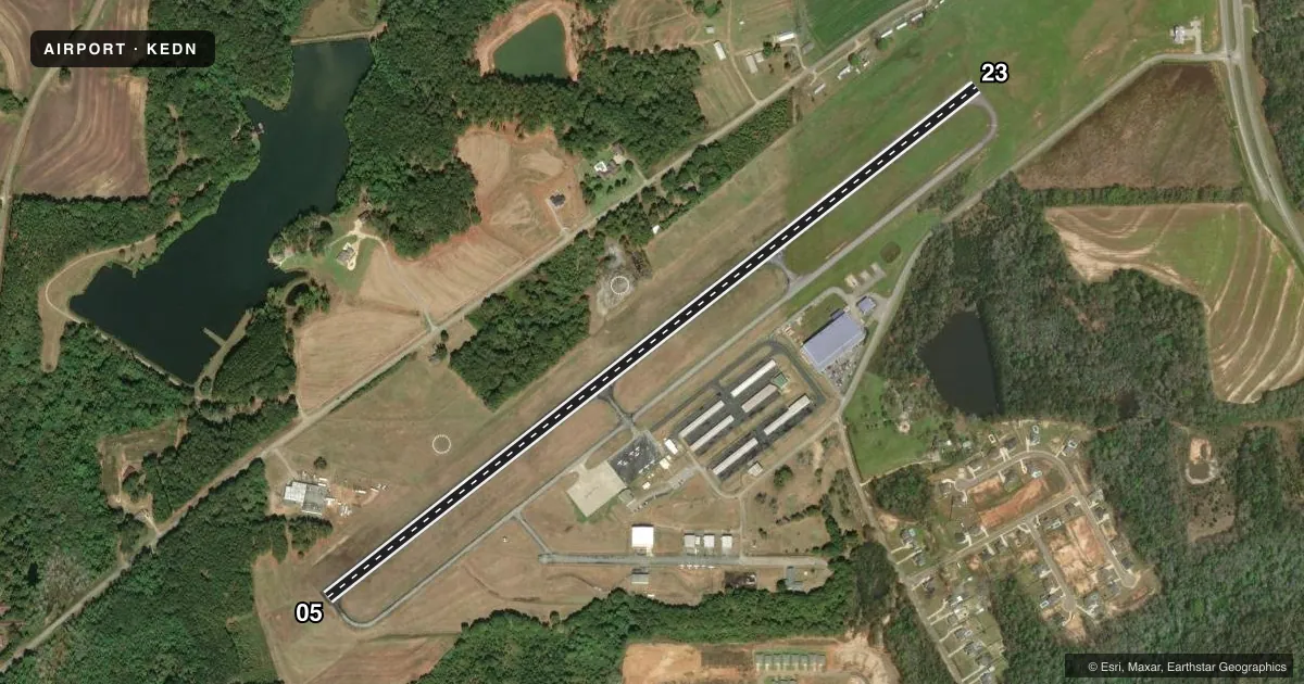 Top-down satellite sketch of KEDN ENTERPRISE MUNI in ENTERPRISE, ALABAMA, showing runways 05/23 drawn to scale over Esri World Imagery