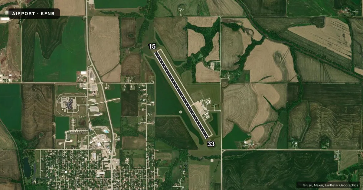 Top-down satellite sketch of KFNB BRENNER FLD in FALLS CITY, NEBRASKA, showing runways 15/33 drawn to scale over Esri World Imagery