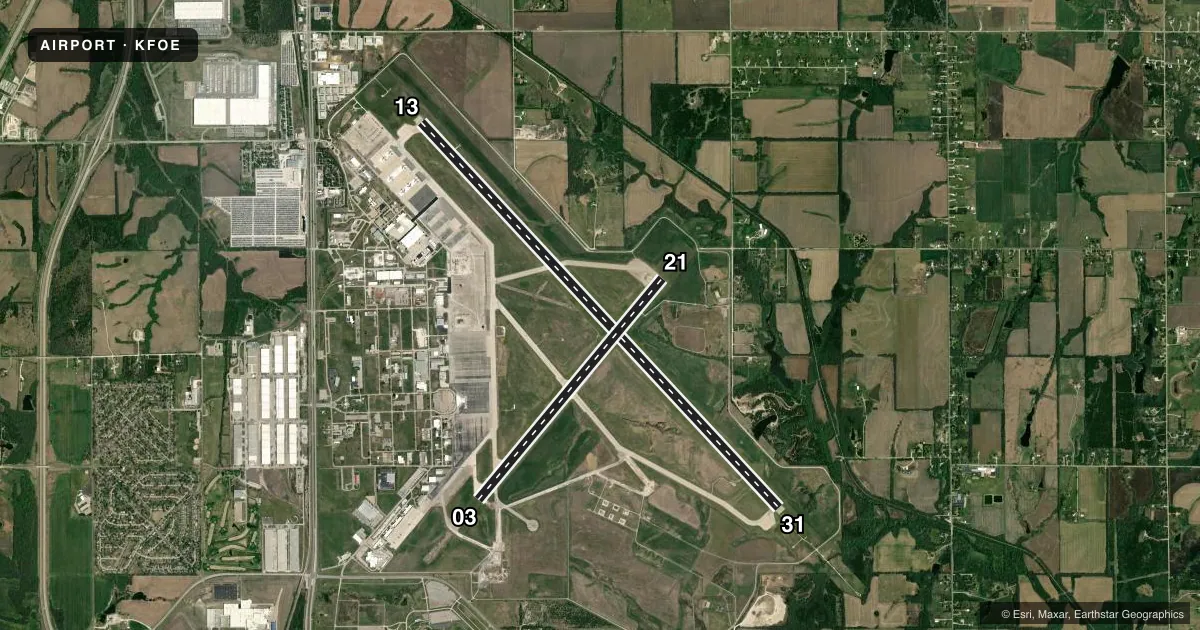 Top-down satellite sketch of KFOE TOPEKA RGNL in TOPEKA, KANSAS, showing runways 13/31, 03/21 drawn to scale over Esri World Imagery