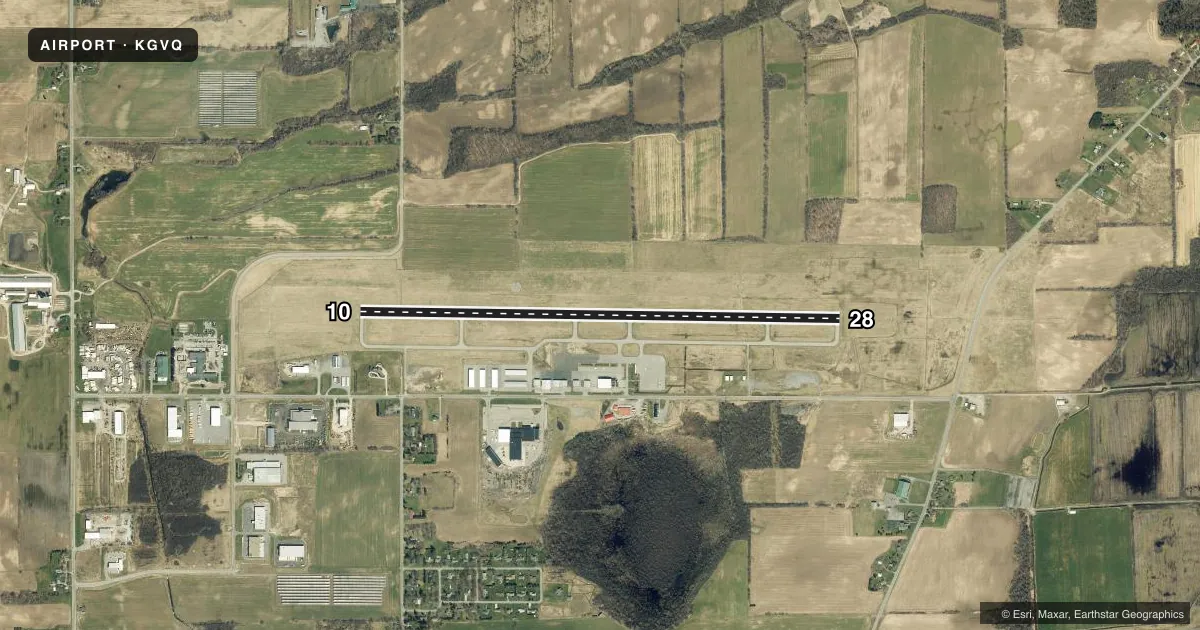 Top-down satellite sketch of KGVQ GENESEE COUNTY in BATAVIA, NEW YORK, showing runways 10/28 drawn to scale over Esri World Imagery