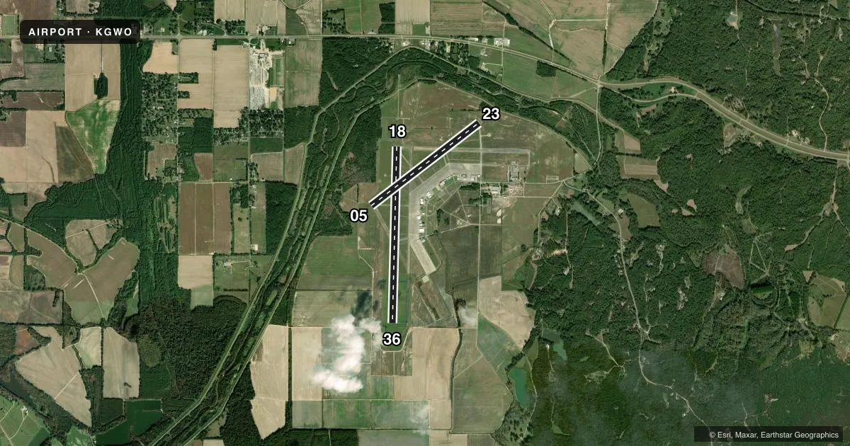 Top-down satellite sketch of KGWO GREENWOOD-LEFLORE in GREENWOOD, MISSISSIPPI, showing runways 18/36, 05/23 drawn to scale over Esri World Imagery