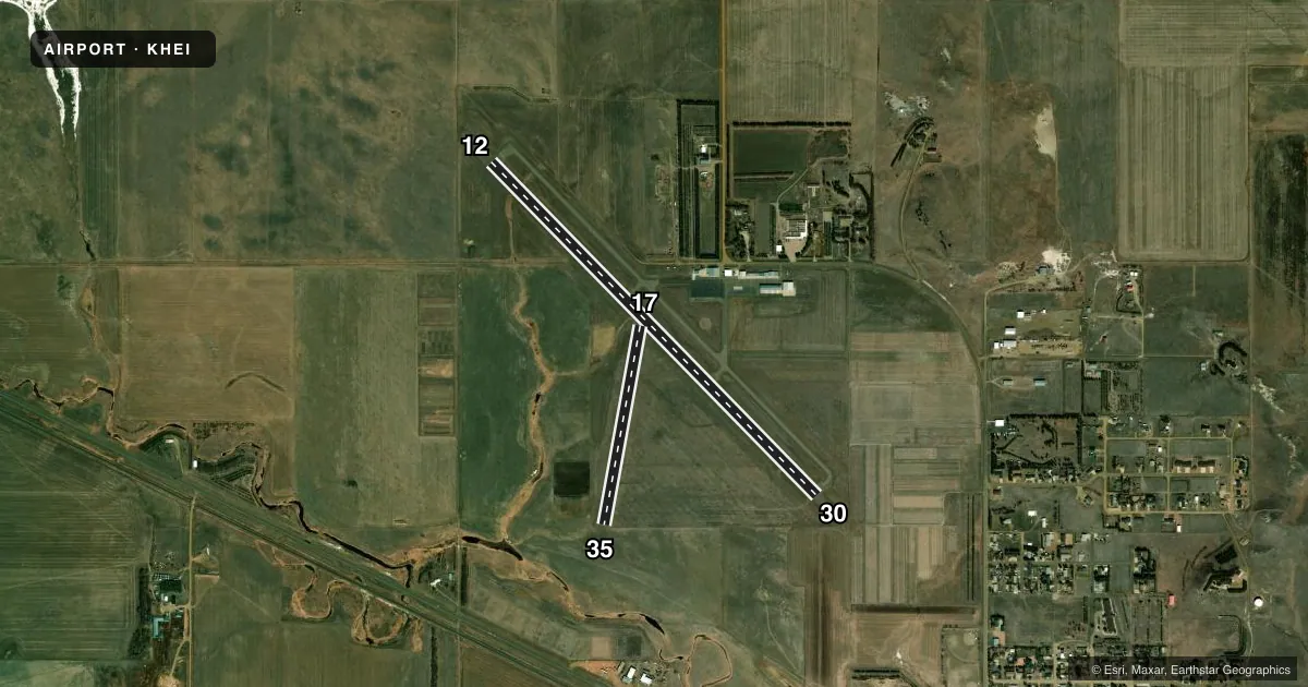 Top-down satellite sketch of KHEI HETTINGER/JB LINDQUIST RGNL in HETTINGER, NORTH DAKOTA, showing runways 12/30, 17/35 drawn to scale over Esri World Imagery