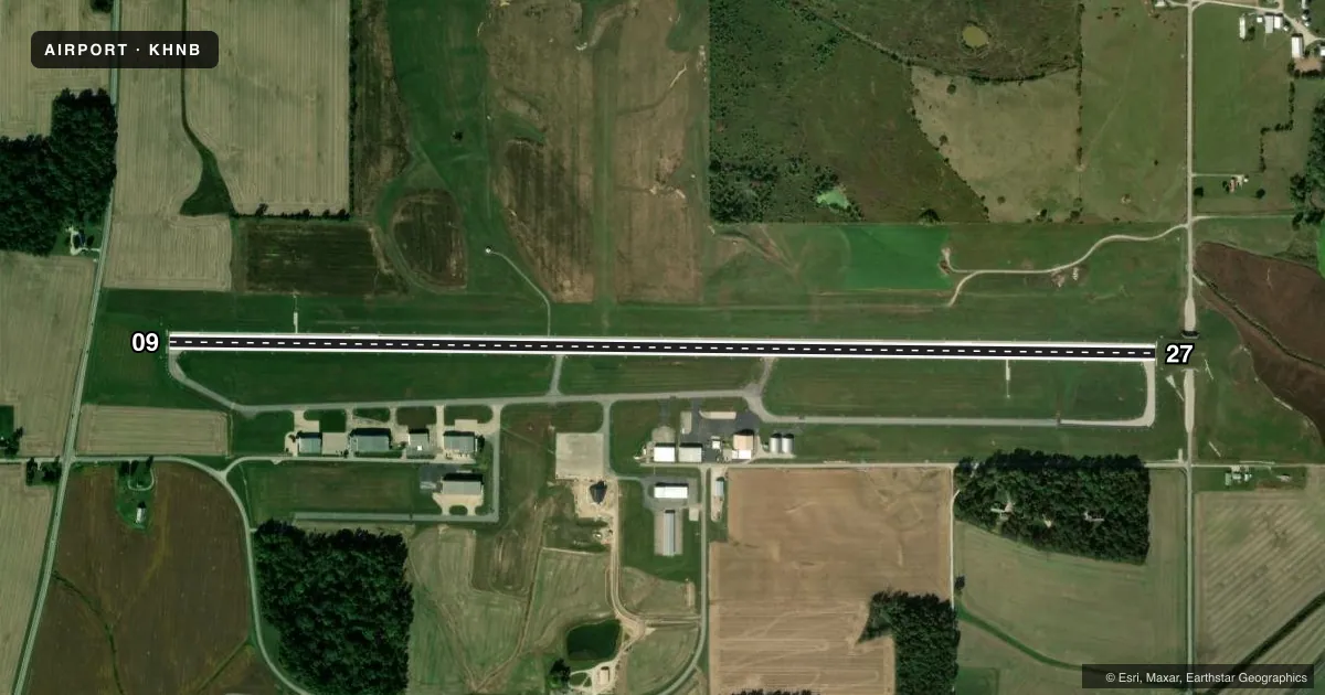 Top-down satellite sketch of KHNB HUNTINGBURG in HUNTINGBURG, INDIANA, showing runways 09/27 drawn to scale over Esri World Imagery