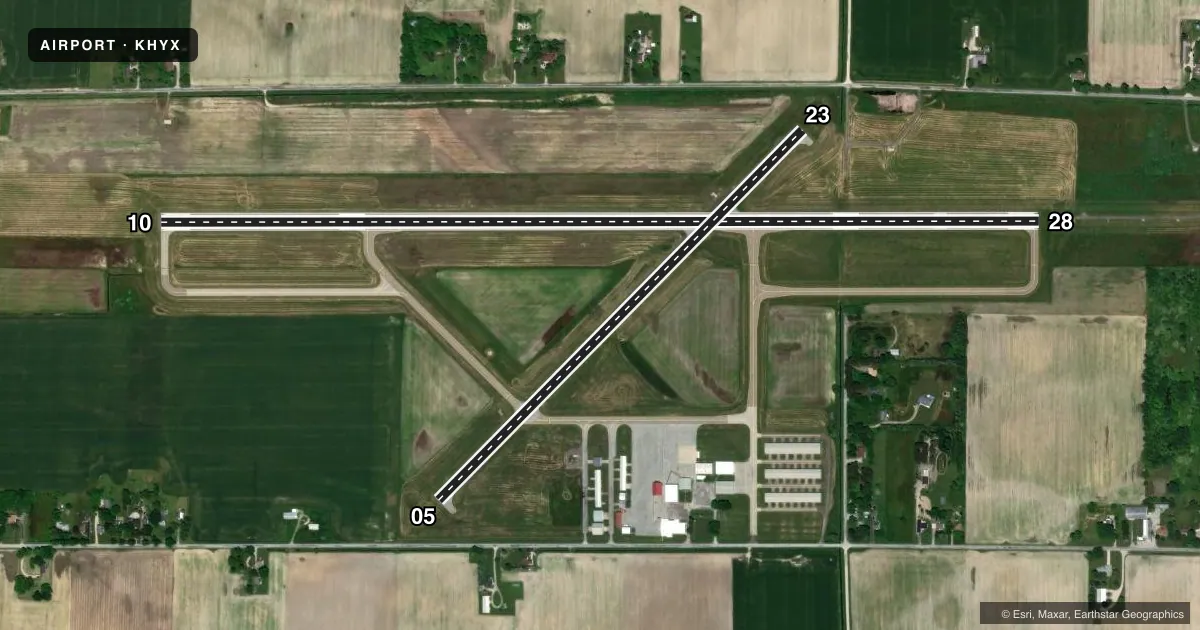 Top-down satellite sketch of KHYX SAGINAW COUNTY/H W BROWNE in SAGINAW, MICHIGAN, showing runways 10/28, 05/23 drawn to scale over Esri World Imagery