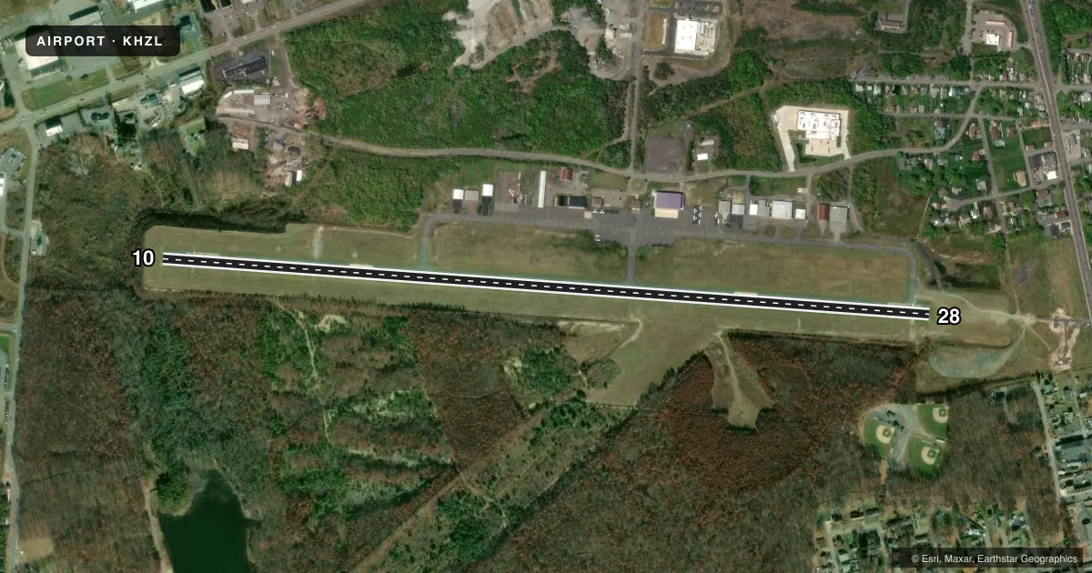 Top-down satellite sketch of KHZL HAZLETON RGNL in HAZLETON, PENNSYLVANIA, showing runways 10/28 drawn to scale over Esri World Imagery