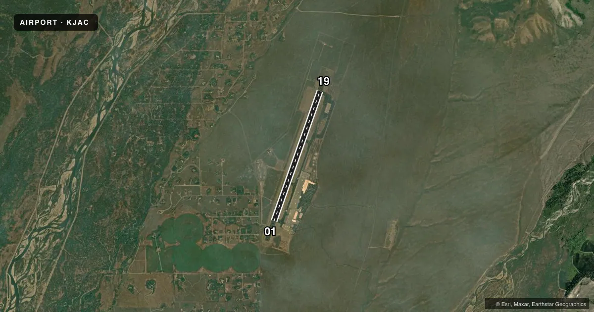 Top-down satellite sketch of KJAC JACKSON HOLE in JACKSON, WYOMING, showing runways 01/19 drawn to scale over Esri World Imagery