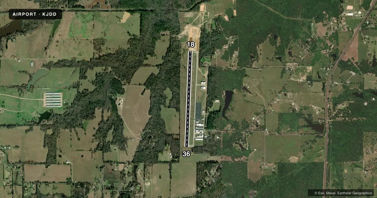 Top-down satellite sketch of KJDD WOOD COUNTY/COLLINS FLD in MINEOLA/QUITMAN, TEXAS, showing runways 18/36 drawn to scale over Esri World Imagery