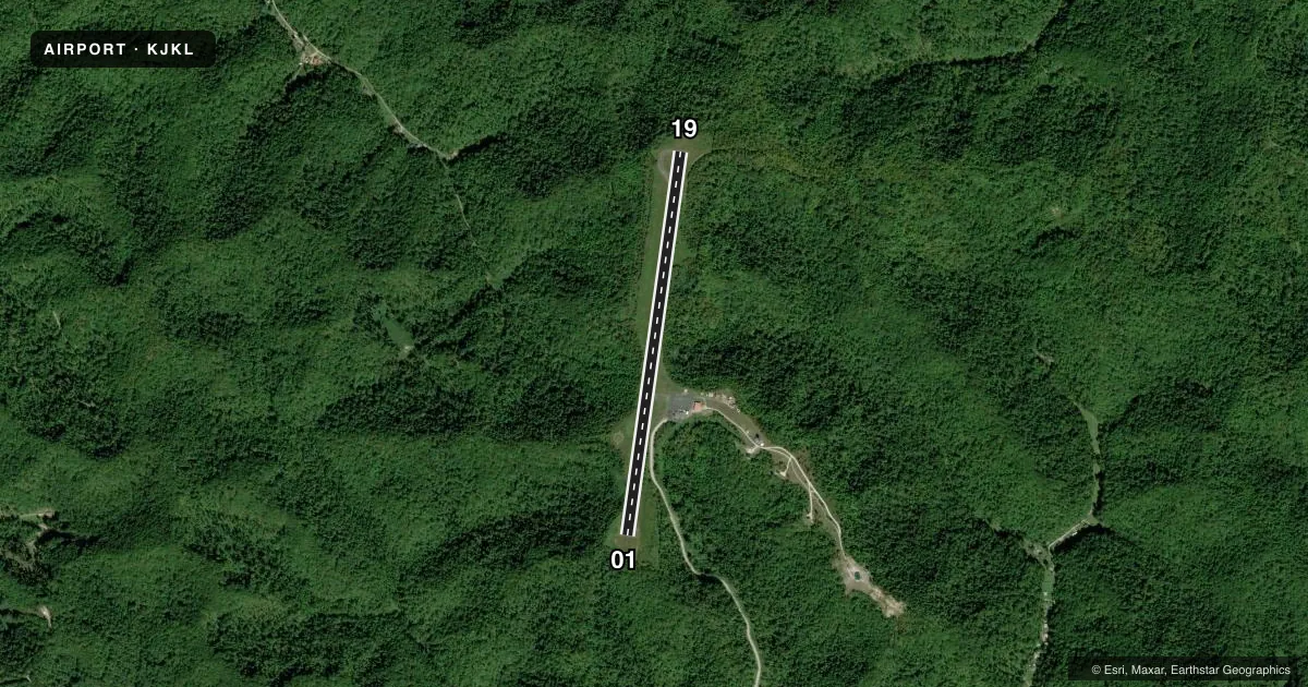 Top-down satellite sketch of KJKL JULIAN CARROLL in JACKSON, KENTUCKY, showing runways 01/19 drawn to scale over Esri World Imagery