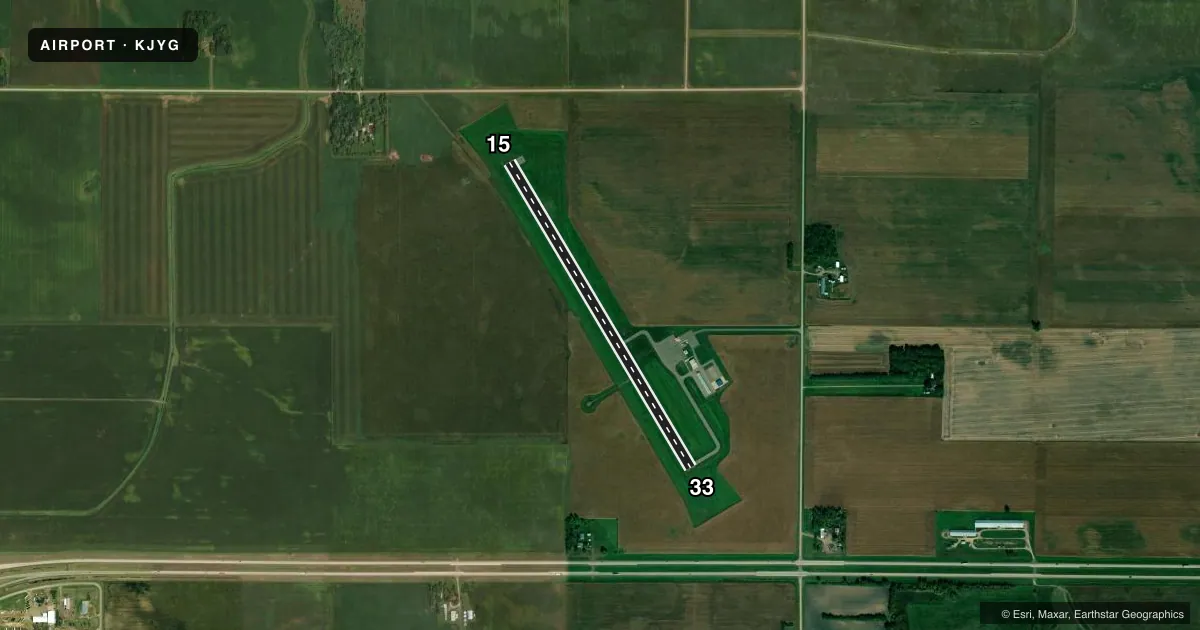 Top-down satellite sketch of KJYG ST JAMES MUNI in ST JAMES, MINNESOTA, showing runways 15/33 drawn to scale over Esri World Imagery