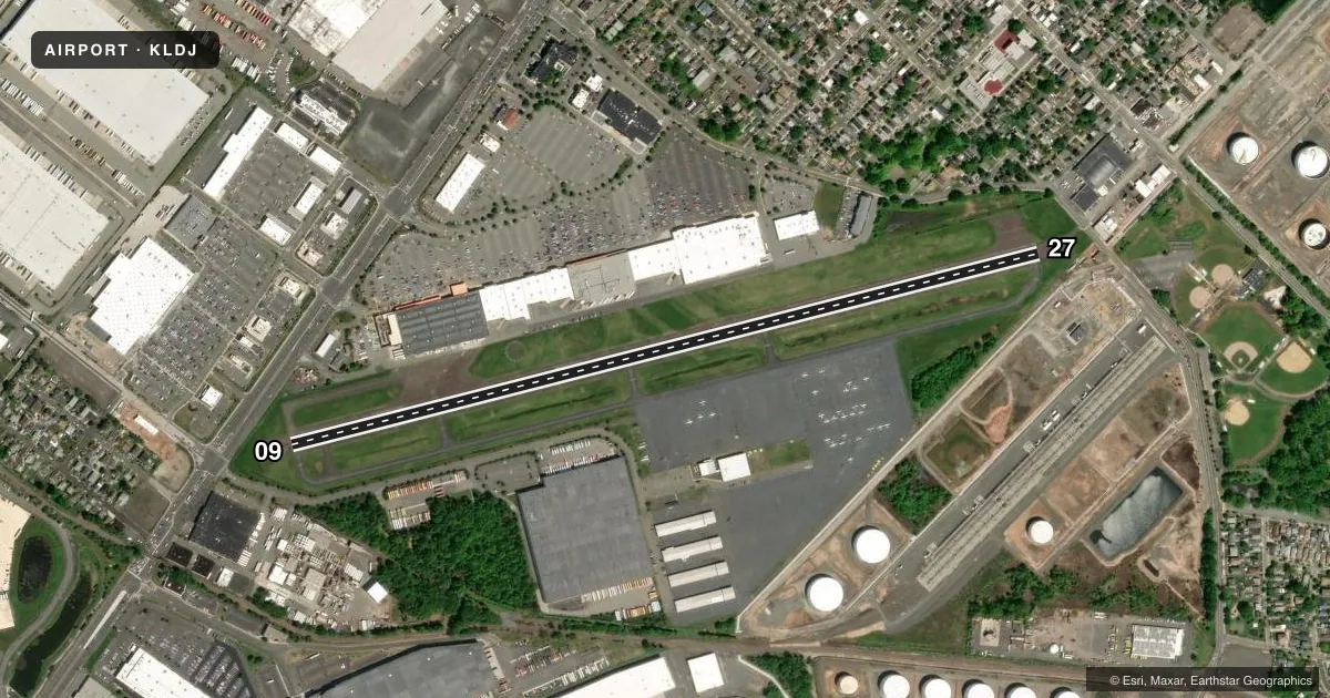 Top-down satellite sketch of KLDJ LINDEN in LINDEN, NEW JERSEY, showing runways 09/27 drawn to scale over Esri World Imagery