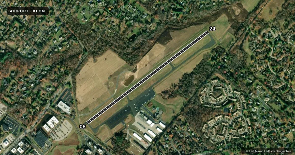 Top-down satellite sketch of KLOM WINGS FLD in PHILADELPHIA, PENNSYLVANIA, showing runways 06/24 drawn to scale over Esri World Imagery