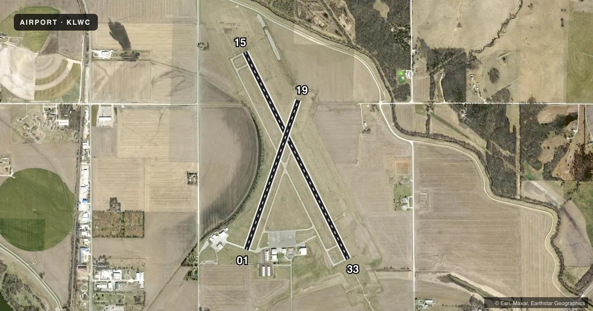 Top-down satellite sketch of KLWC LAWRENCE RGNL in LAWRENCE, KANSAS, showing runways 15/33, 01/19 drawn to scale over Esri World Imagery
