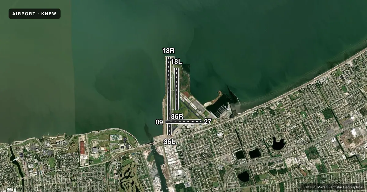 Top-down satellite sketch of KNEW LAKEFRONT in NEW ORLEANS, LOUISIANA, showing runways 18R/36L, 18L/36R, 09/27 drawn to scale over Esri World Imagery