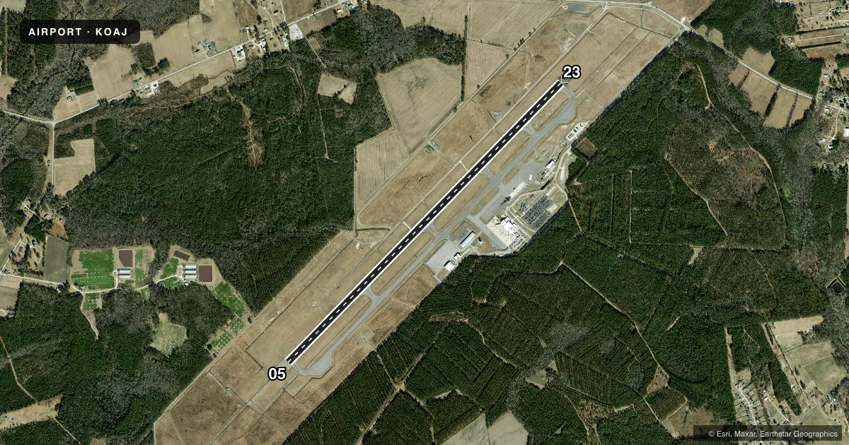 Top-down satellite sketch of KOAJ ALBERT J ELLIS in JACKSONVILLE, NORTH CAROLINA, showing runways 05/23 drawn to scale over Esri World Imagery