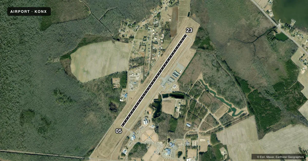Top-down satellite sketch of KONX CURRITUCK COUNTY RGNL in CURRITUCK, NORTH CAROLINA, showing runways 05/23 drawn to scale over Esri World Imagery