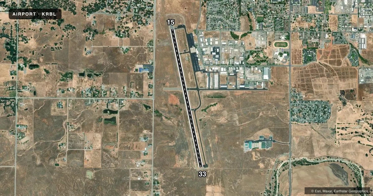 Top-down satellite sketch of KRBL RED BLUFF MUNI in RED BLUFF, CALIFORNIA, showing runways 15/33 drawn to scale over Esri World Imagery