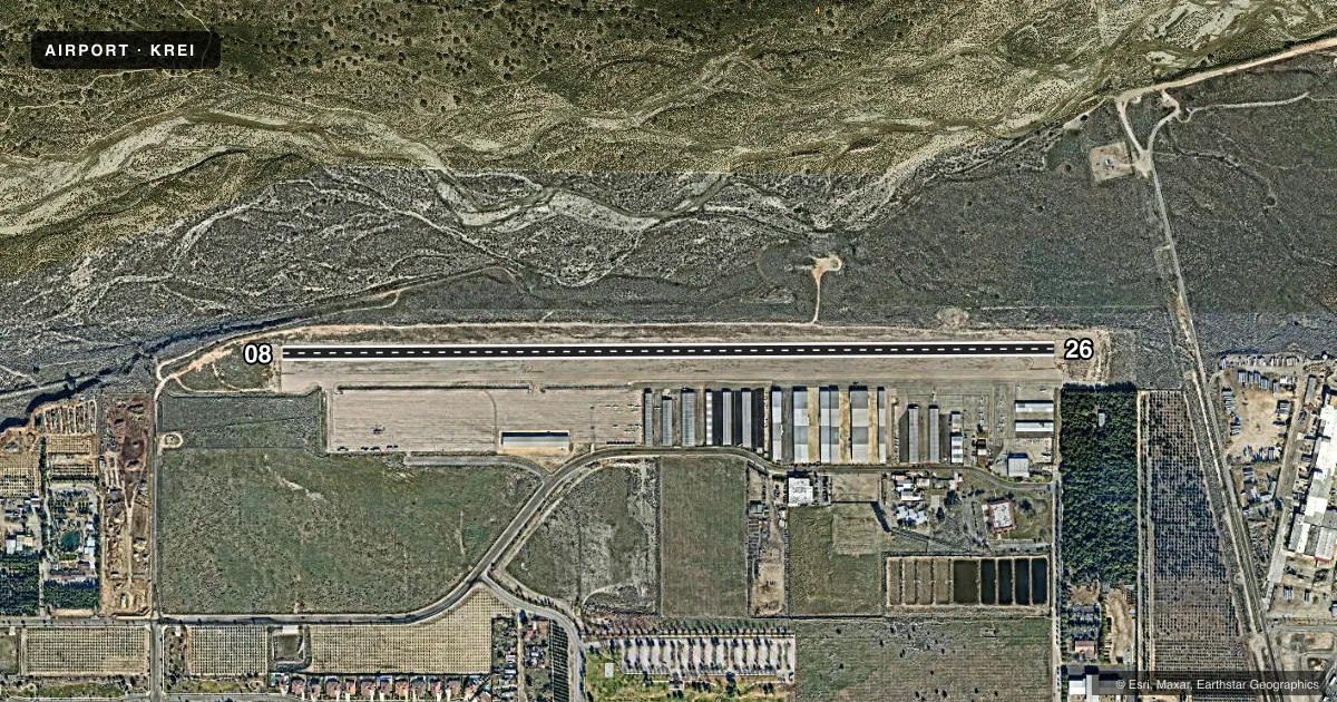 Top-down satellite sketch of KREI REDLANDS MUNI in REDLANDS, CALIFORNIA, showing runways 08/26 drawn to scale over Esri World Imagery