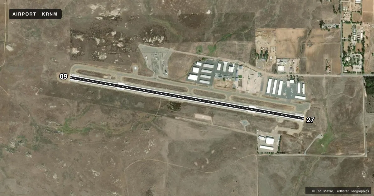 Top-down satellite sketch of KRNM RAMONA in RAMONA, CALIFORNIA, showing runways 09/27 drawn to scale over Esri World Imagery