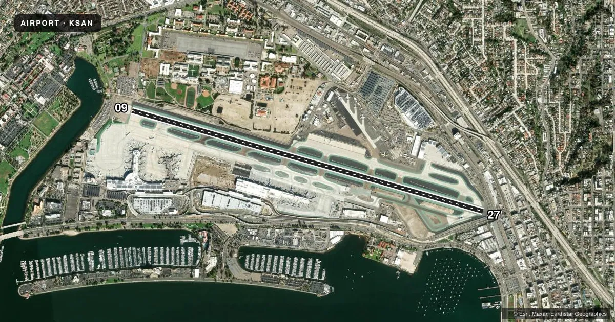 Top-down satellite sketch of KSAN SAN DIEGO INTL in SAN DIEGO, CALIFORNIA, showing runways 09/27 drawn to scale over Esri World Imagery