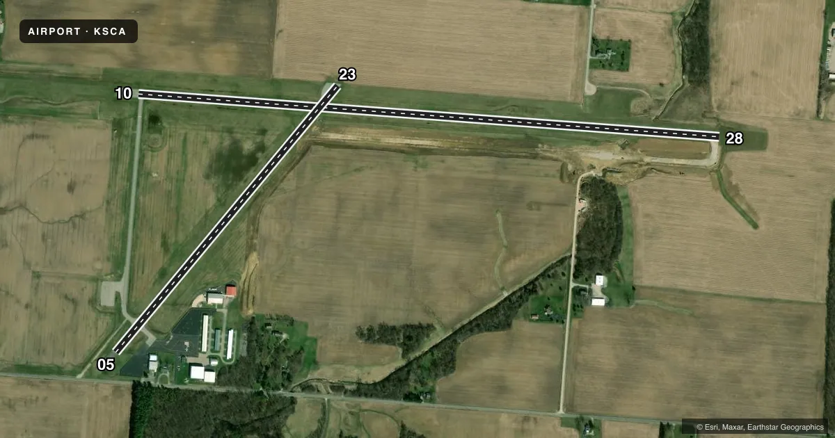 Top-down satellite sketch of KSCA SIDNEY MUNI in SIDNEY, OHIO, showing runways 10/28, 05/23 drawn to scale over Esri World Imagery