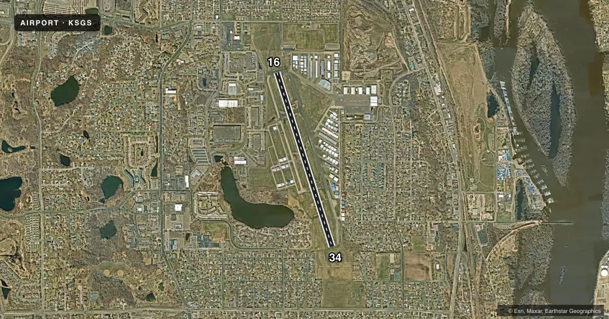 Top-down satellite sketch of KSGS SOUTH ST PAUL MUNI/RICHARD E FLEMING FLD in SOUTH ST PAUL, MINNESOTA, showing runways 16/34 drawn to scale over Esri World Imagery