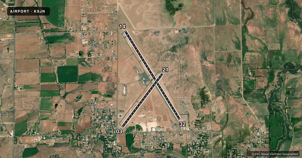 Top-down satellite sketch of KSJN ST JOHNS INDUSTRIAL AIR PARK in ST JOHNS, ARIZONA, showing runways 14/32, 03/21 drawn to scale over Esri World Imagery