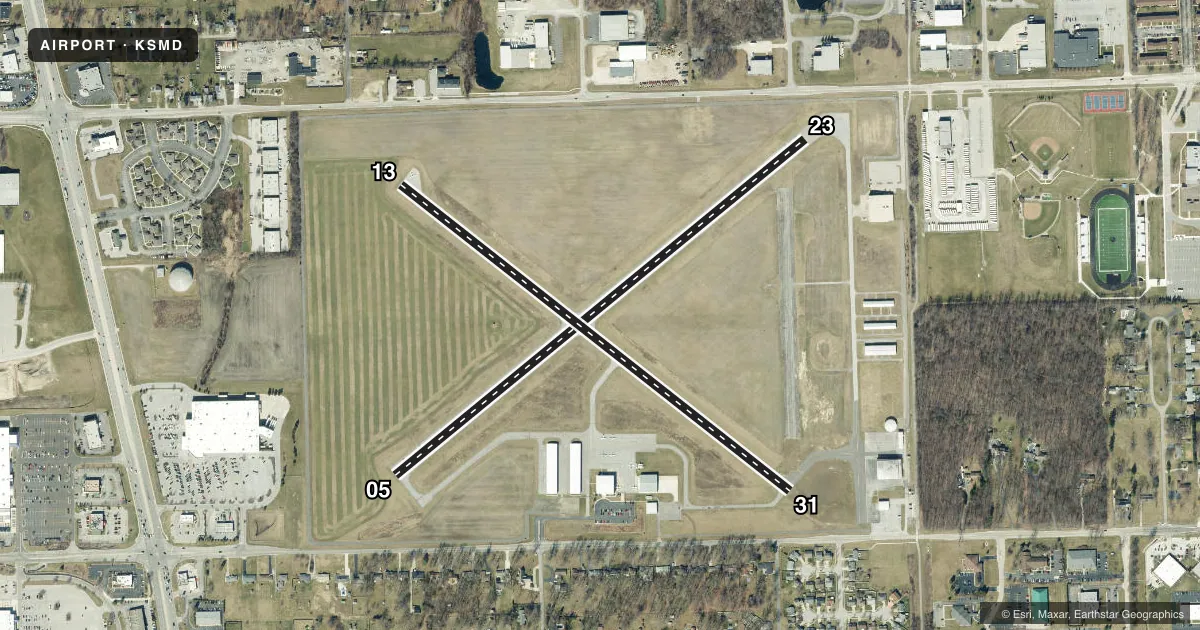 Top-down satellite sketch of KSMD SMITH FLD in FORT WAYNE, INDIANA, showing runways 05/23, 13/31 drawn to scale over Esri World Imagery