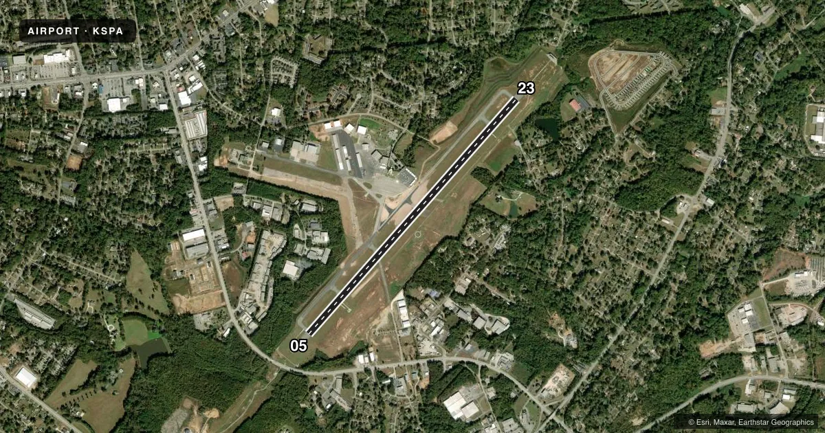 Top-down satellite sketch of KSPA SPARTANBURG DOWNTOWN MEML/SIMPSON FLD in SPARTANBURG, SOUTH CAROLINA, showing runways 05/23 drawn to scale over Esri World Imagery