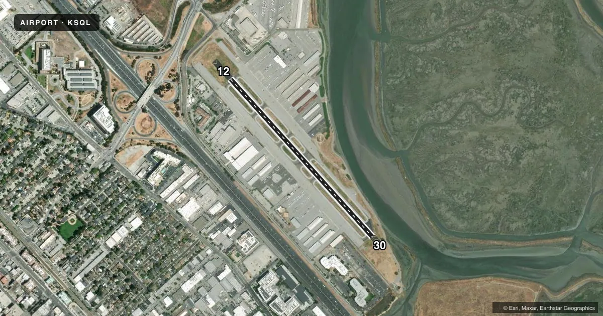 Top-down satellite sketch of KSQL SAN CARLOS in SAN CARLOS, CALIFORNIA, showing runways 12/30 drawn to scale over Esri World Imagery