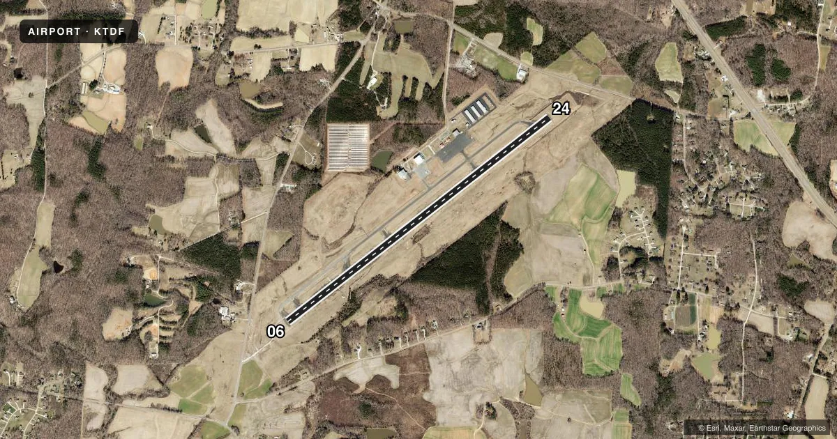 Top-down satellite sketch of KTDF RALEIGH RGNL AT PERSON COUNTY in ROXBORO, NORTH CAROLINA, showing runways 06/24 drawn to scale over Esri World Imagery