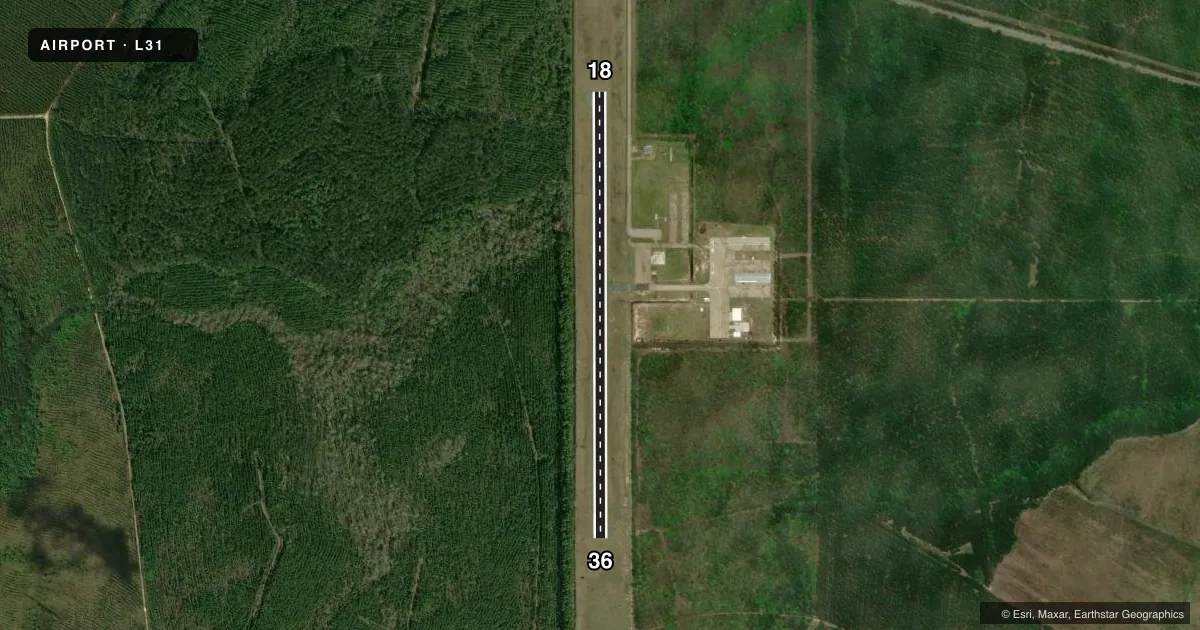Top-down satellite sketch of L31 ST TAMMANY RGNL in COVINGTON, LOUISIANA, showing runways 18/36 drawn to scale over Esri World Imagery