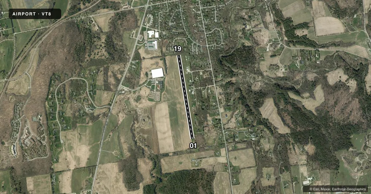 Top-down satellite sketch of VT8 SHELBURNE in SHELBURNE, VERMONT, showing runways 01/19 drawn to scale over Esri World Imagery